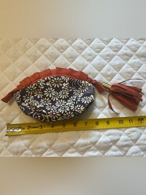Anthropologie Miss Albright Purple Floral Wristlet with Rust Tassel Trim
